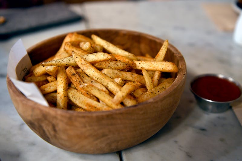 Crispy seasoned fries in a basket